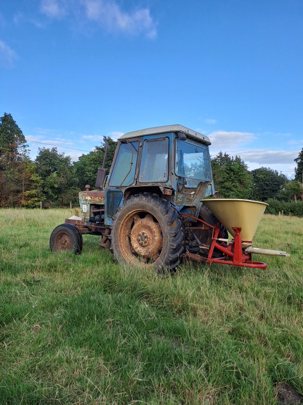 July 18th, 2025 - The Fertiliser Spreader at work on the farm in The field next to the shed.